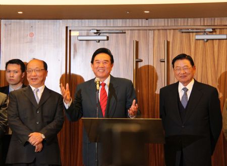 Chen Yunlin (R2), president of the Chinese mainland's Association for Relations Across the Taiwan Straits (ARATS), speaks as he visits the city construction of Taichung, accompanied by Chiang Pin-kung (R), chairman of Taiwan's Straits Exchange Foundation (SEF), and Taichung Mayor Jason Hu, in southeast China's Taiwan, Dec. 21, 2009. (Xinhua/Xu Qun)